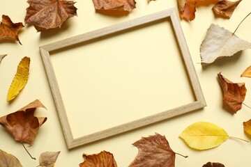 Various autumn leaves on color Various autumn leaves with wooden frame on color background
