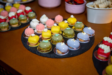 Colorful and delicate pastry assortment showcases the artistry of dessert creation at a gourmet event in the evening