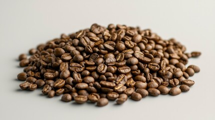 Naklejka premium Coffee beans piled on gray background for cafe menu or product shot