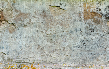 Old destroyed plaster wall of an abandoned temple as a background.