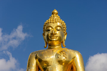 Fototapeta premium Golden Buddha statue in the Golden Triangle, Thailand