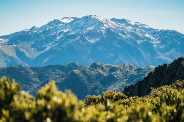 Fototapeta premium A distant view of a mountain range with varying elevations and terrain