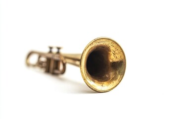 A golden trumpet placed on a clean white surface, perfect for editorial or commercial use