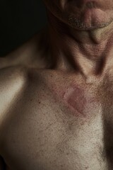 Fototapeta premium Close-up shot of a man's chest and abdomen, highlighting the definition and muscle tone