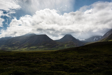 Fototapeta premium Icelandic landscape with mountains, clouds and icelandic nature
