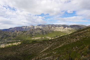 Naklejka premium The mountain panorama opening from the hiking path to pick Puig Campana, Finestrat, Benidorm, Spain