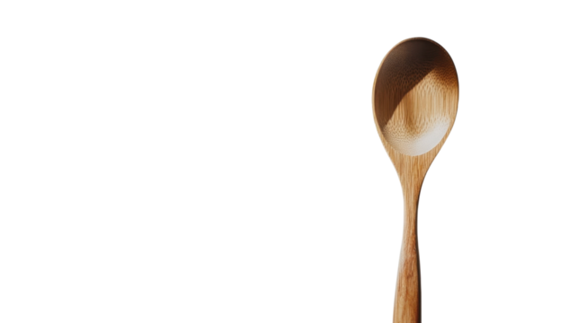 Wooden spoon resting against a plain white background, showcasing its natural grain and craftsmanship details for culinary enthusiasts