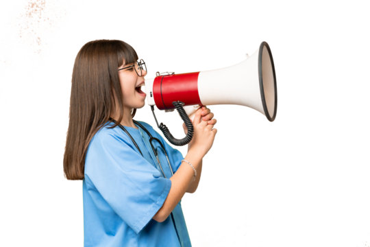Little girl as a surgeon doctor over isolated chroma key background shouting through a megaphone