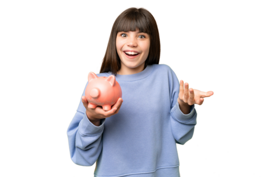 Little girl holding a piggybank over isolated chroma key background with shocked facial expression