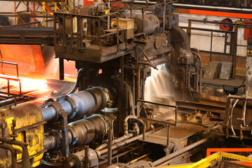 Hot steel rolling mill in operation.