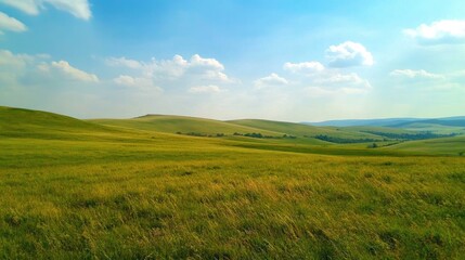 Obraz premium Serene Rolling Hills Landscape Under a Blue Sky