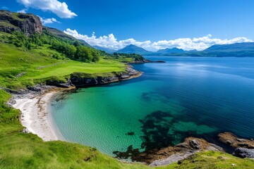 Fototapeta premium Turquoise bay embraces sandy beach on the scottish coastline under blue skies