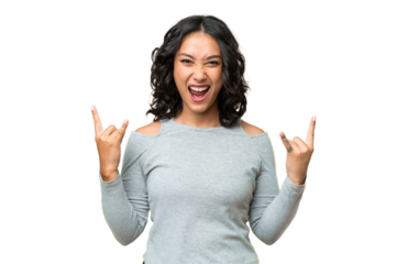 Young Argentinian woman over isolated background making horn gesture