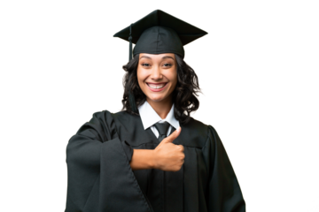 Young university graduate Argentinian woman over isolated background giving a thumbs up gesture