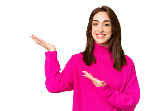 Young caucasian woman over isolated chroma key background extending hands to the side for inviting to come