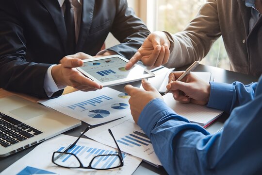 Business Team Meeting Analyzing Financial Data Graphs Charts Tablet Digital Technology Modern Workplace Collaboration Professional Teamwork Strategic Planning Successful Business Growth Development   