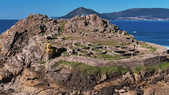Ancient Hill Fort Of Castro de Baro&ntilde;a With The Atlantic Ocean At Background In Galicia, Spain. Aerial, Approaching Shot