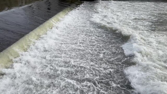 Water flows down a weir