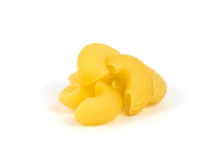 Curved pasta shapes are stacked in a neat pile on a white surface