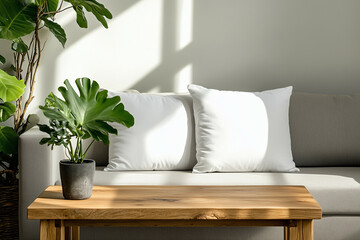 Mockup of two white pillows on a light grey sofa near a wooden coffee table in a Scandinavian-style room.