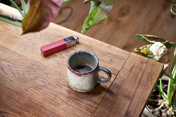 there's a cup of coffee on the table with a red lipstick imprint on it