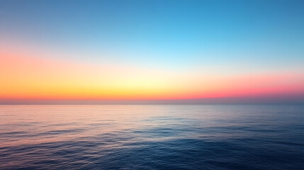 Obraz premium Serene Sunset over the Ocean: A breathtaking vista unfolds as the sun dips below the horizon, painting the sky with vibrant hues of orange, pink, and blue.