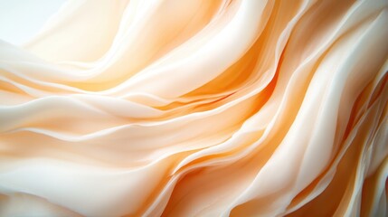 Obraz premium A stunning close-up of elegant flowing fabric in soft peach and beige shades, embodying grace and artistry, perfect for fashion photography and creative compositions.
