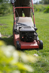 Lawn mover on green grass. Machine for cutting lawns.