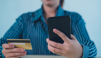 online shopping concept. hands holding credit card and using smart phone. shopping online payment by using smart phone.