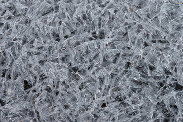 Frozen stream and ice closeup photo. Beautiful winter abstract background in nature. Concept for...