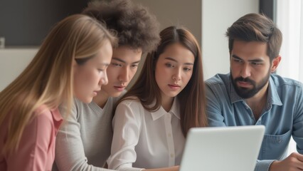 Growth Strategy concept. Group of young people collaborating on a laptop in a modern workspace.