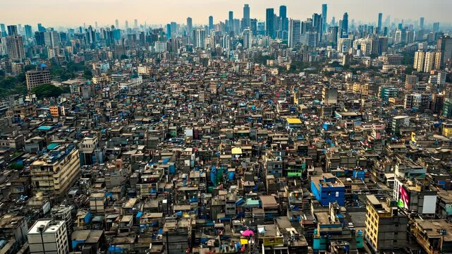 Aerial View of Mumbai's Dharavi Slum juxtaposed with the Modern Skyline: A Contrast of Urban Extremes