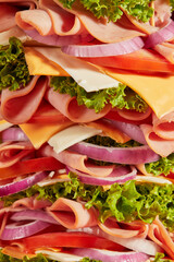 Delicious tall sandwich stacked high with fresh ingredients