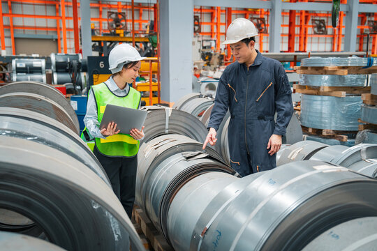 Professional expertise engineering and inspector of Mechanic are checking or examining the quality of Plate rolling metal sheet with order of industry or factory, Rolling machine quality control.