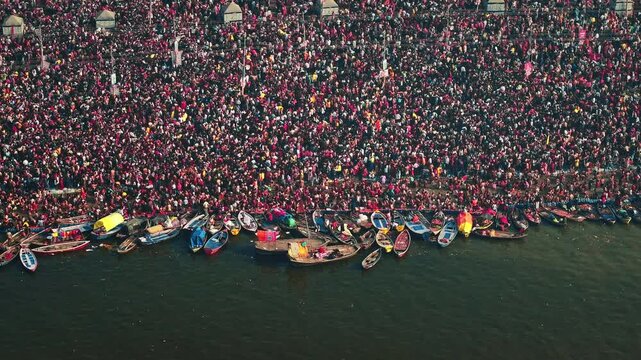 Aerial view of Huge crowd at Triveni Sangam in Prayagraj, India during Maha Kumbh. Kumbh Mela is the most important event, where millions of devotees, including Sadhu take a sacred holy dip in Ganga.