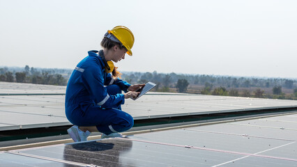 Professional Solar Technician on Roof Conducting Inspection of Photovoltaic Panels – Renewable Energy and Green Technology Concept