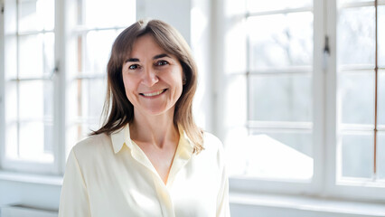 Happy and Smiling 50-Year-Old Female Psychologist Portrait for Professional Services Advertising