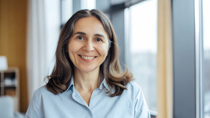 Happy and Smiling 50-Year-Old Female Psychologist Portrait for Professional Services Advertising