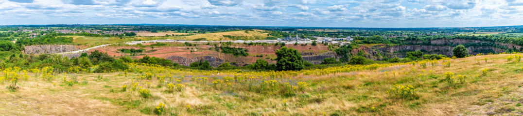 A panorama view from Croft Hill across Croft Quarry in Leicestershire, UK on a summers day