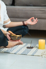 Woman doing yoga at home and aromatherapy. Selective focus.