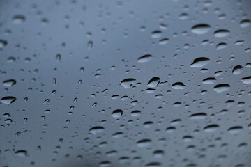 close-up of isolated raindrops on a window pane
