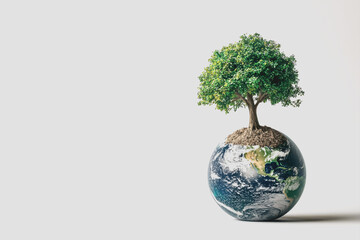 Small tree growing out of a small globe symbolizing environmental conservation and global awareness