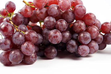 Fototapeta premium Ripe red grape on a white background, freshness