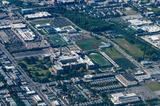 Chicago, Illinois, USA - September 2, 2023 - Aerial view of DePaul College Prep High School and Lane Technical College High School.   There is a football game happening at Depaul's stadium 