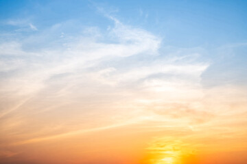 Fototapeta premium Beautiful , luxury soft gradient orange gold clouds and sunlight on the blue sky perfect for the background, take in evening,Twilight, Large size, high definition landscape photo