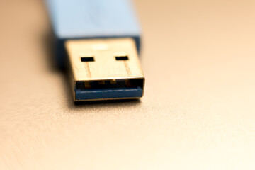 USB-A connector close-up. Blue and black detail. Technology shot, data transfer. Macro view, blurred background.