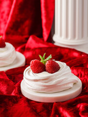 pavlova meringue dessert with raspberries and cream