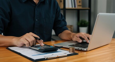 Entrepreneur calculating expenses and analyzing finances at work desk with coins and documents