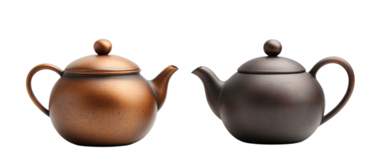 Pair of brown and black ceramic teapots with lids on transparent background