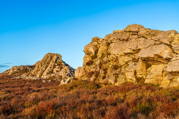 Landscape image of sunset colours at a rock formation on the Stiperstones National Nature Reserve in Shropshire in the UK